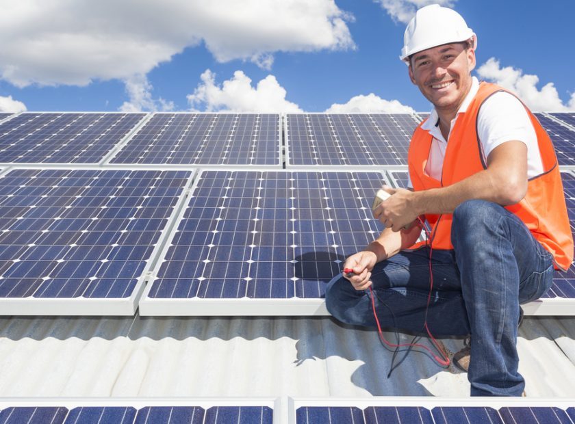 Solar,Panel,Technician,On,Roof