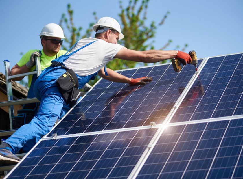 Two,Workers,Technicians,Installing,Heavy,Solar,Photo,Voltaic,Panels,To
